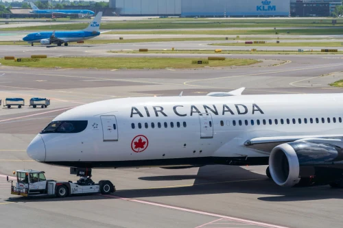 Air Canada Boeing 787 (AC) taxiing on the airport apron.