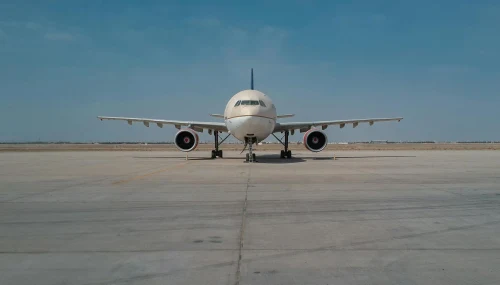 A China Airlines Airbus A310 is parked on the apron.