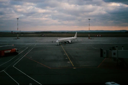 Alitalia (AZ) aircraft on the apron.
