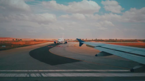 Fly (1F) aircraft on the apron under clear skies.