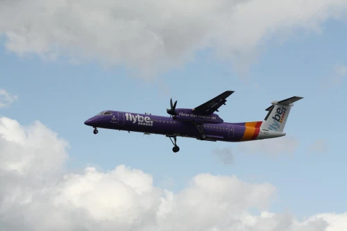 Flybe (BE) aircraft on the apron under clear skies.