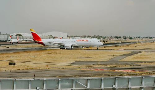 Iberia (IB) aircraft on the apron.