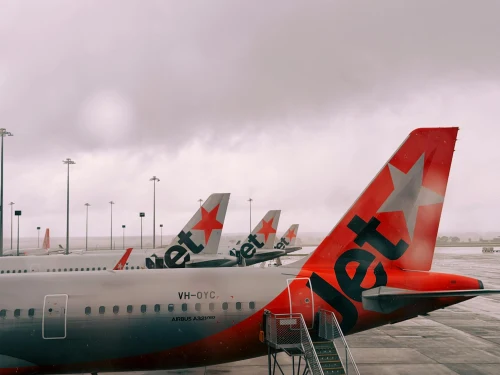 Jetstar (JQ) aircraft on the apron.