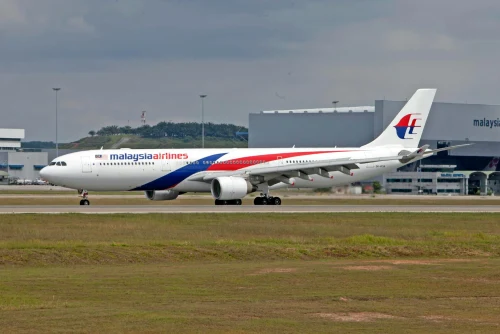 Malaysia Airlines (MH) aircraft on the apron.