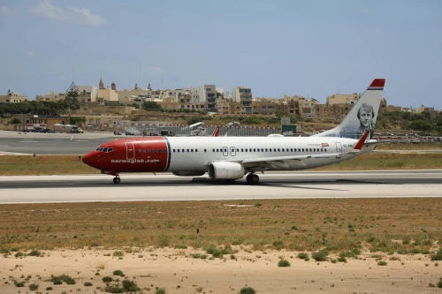 Norwegian Airlines Boeing 737 (DY) on the airport apron.