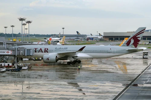 Qatar Airways (QR) aircraft on the apron.
