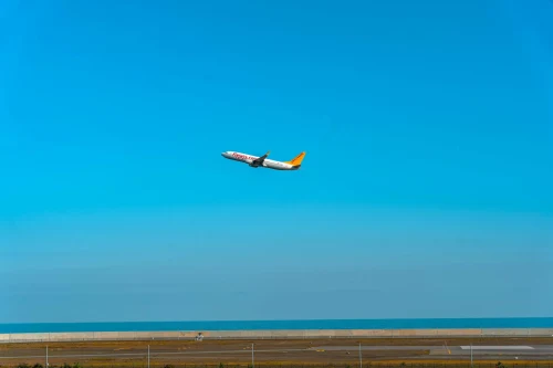 A Tway Air Boeing 737 is seen taking off over the runway.