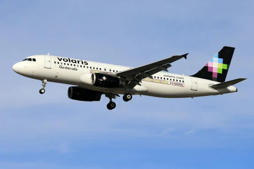 Volaris (Y4) aircraft on the apron under clear skies.