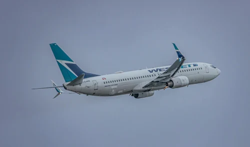 Westjet (WJ) aircraft on the apron.