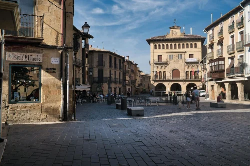 Historic plaza with traditional architecture in Laguardia, Spain. A sunny day highlighting rustic facades