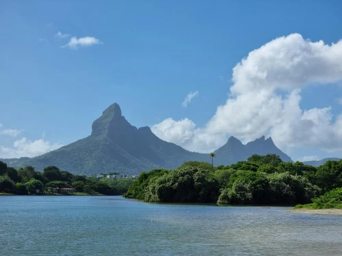Capture of Mauritius' iconic mountains and lagoon under clear blue sky