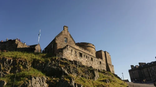 A majestic view of Edinburgh Castle on a sunny day, showcasing its historic architecture