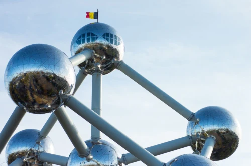 The Atomium in Brussels, a striking modern architectural landmark with metallic spheres under a blue sky