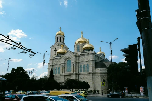 Street view of Varna Cathedral's golden domes in Bulgaria against a clear sky