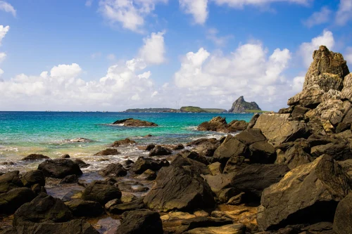 Beautiful rocky coastline with turquoise sea and clear sky, perfect for travel inspiration