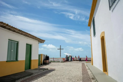 Picturesque street with colonial architecture in Porto Seguro, Brazil, under a clear blue sky