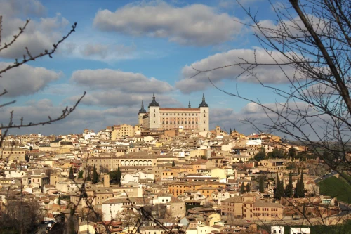 Stunning landscape photo of Toledo, featuring the historic Alcázar on a sunny day