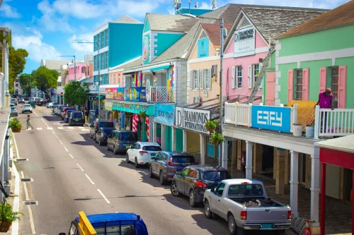 Colorful shops and local life on a sunny street in Nassau, Bahamas
