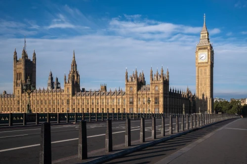 Iconic view of Big Ben and the Palace of Westminster in London, UK, under a blue sky