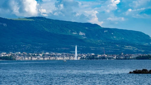 panorama of Geneva cityscape and iconic Jet d'Eau fountain under a clear sky