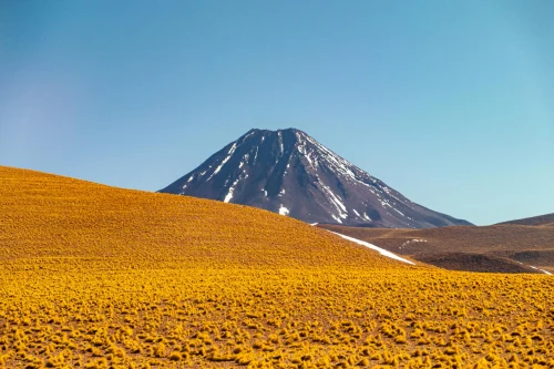 Stunning view of Licancabur Volcano against clear blue sky in San Pedro de Atacama, Chile