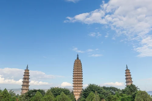The iconic Three Pagodas at Chongsheng Temple against a clear blue sky, Yunnan, China