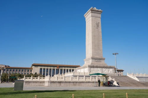 Monument to the People's Heroes in Tiananmen Square, Beijing, China, under a clear blue sky
