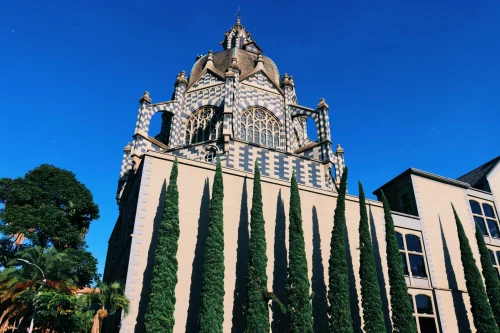 The majestic Palace of Culture in Medellín, Colombia on a sunny day with blue skies