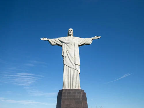 Iconic view of Christ the Redeemer statue against a clear blue sky in Rio de Janeiro, Brazil