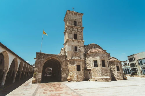 Beautiful historic church in Larnaca, Cyprus with clear blue sky, showcasing stunning Mediterranean architecture