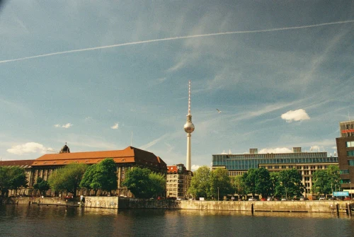 Sunny view of Berlin's skyline with the iconic TV Tower under a clear blue sky