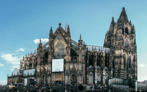 Panoramic view of Cologne Cathedral in Köln, Germany, with a clear blue sky
