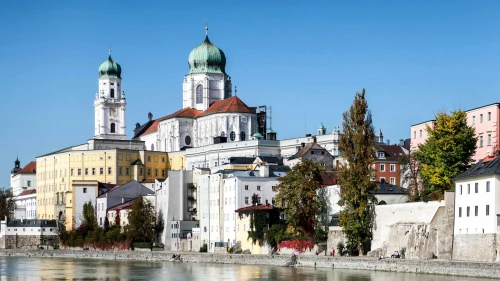 View of St. Stephen's Cathedral and the riverside cityscape of Passau, Germany on a sunny day