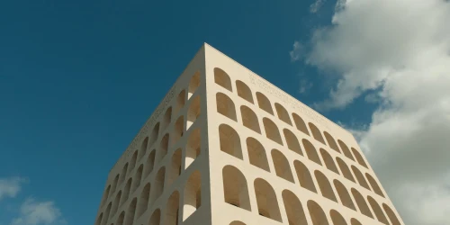 Low angle shot of the iconic Palazzo della Civiltà Italiana against a clear blue sky in Rome, Italy