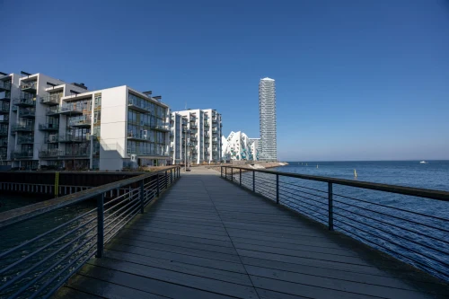 Contemporary buildings along Aarhus waterfront on a clear, sunny day showcasing urban architecture