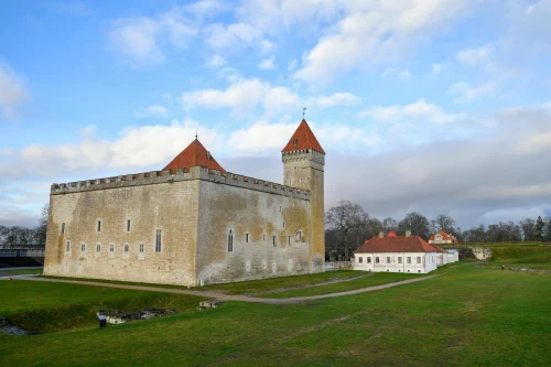 A stunning view of the medieval Kuressaare Castle under a clear blue sky in Estonia