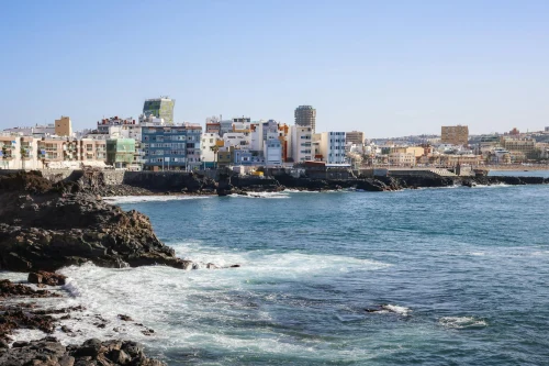 Vibrant cityscape view of Las Palmas de Gran Canaria on a sunny day overlooking the ocean