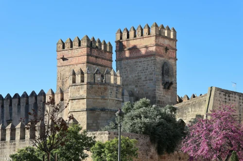 A majestic castle in El Puerto de Santa María, showcasing ancient architectural design under a clear blue sky
