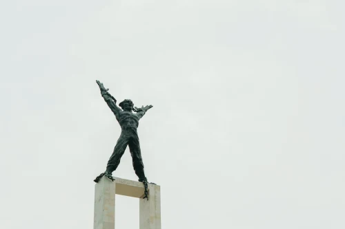 Minimalist photo of the iconic Tugu Selamat Datang monument against a clear sky in Jakarta