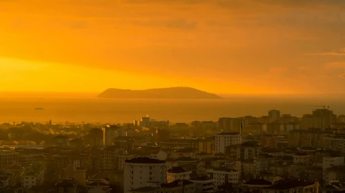 A stunning sunset view over Istanbul with a glowing horizon and island backdrop