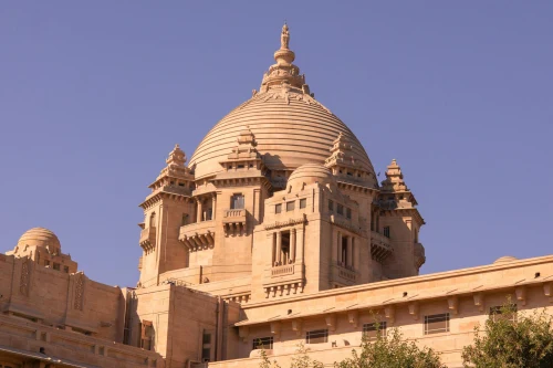 A stunning view of Umaid Bhawan Palace under a clear blue sky in Jodhpur, India