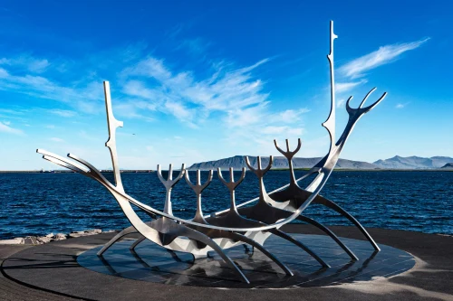 The striking Sólfar Viking ship sculpture in Reykjavík, Iceland against a clear blue sky
