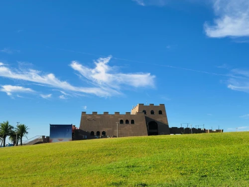 A stunning architecture of Fulong Visitor Center against a clear blue sky