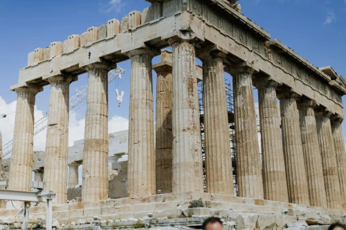 Iconic Parthenon temple on the Acropolis in Athens, Greece with blue sky background
