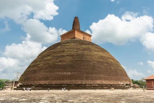 Explore the ancient Abhayagiri Stupa in Anuradhapura under a clear blue sky