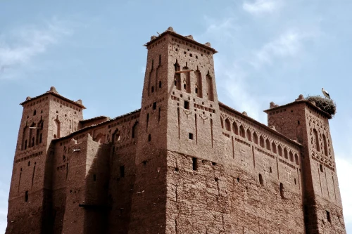 Captivating view of a traditional Kasbah in Ouarzazate, Morocco under a clear blue sky