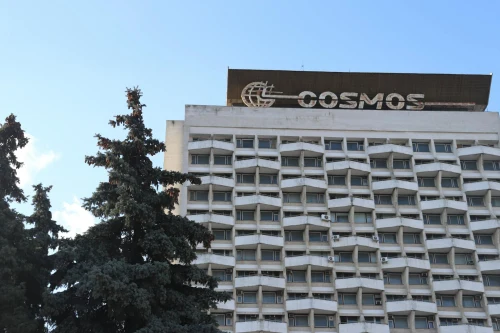 A classic view of the iconic Cosmos Hotel in Chișinău, Moldova against the blue sky