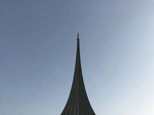 The Space Conquerors Monument under a clear blue sky in Moscow, Russia