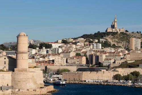 Beautiful daytime view of Marseille featuring Fort Saint-Jean and Notre-Dame de la Garde