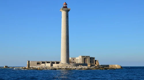 View of the iconic Ile de Planier lighthouse in Marseille against a clear blue sky